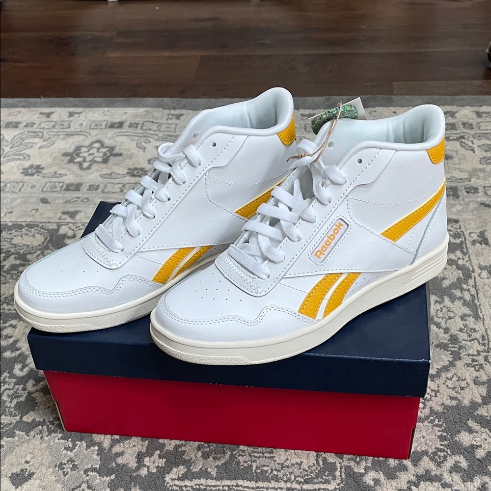 Reebok White and Yellow Club tennis high tops.